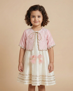Load image into Gallery viewer, Girl wearing baby pink and white raw silk dress with embroidered organza jacket