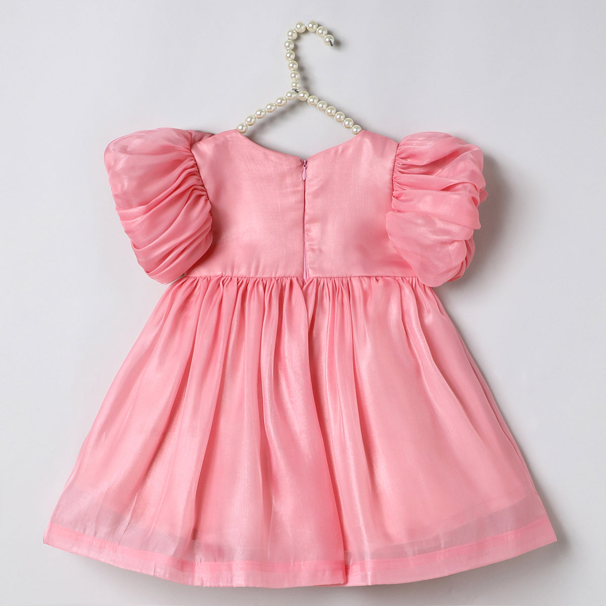 Baby pink tissue girls party dress with puff sleeves & floral embroidery