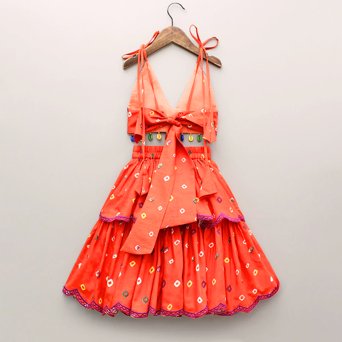 Orange Embroidered Orange bandhani V neck Top and layered skirt