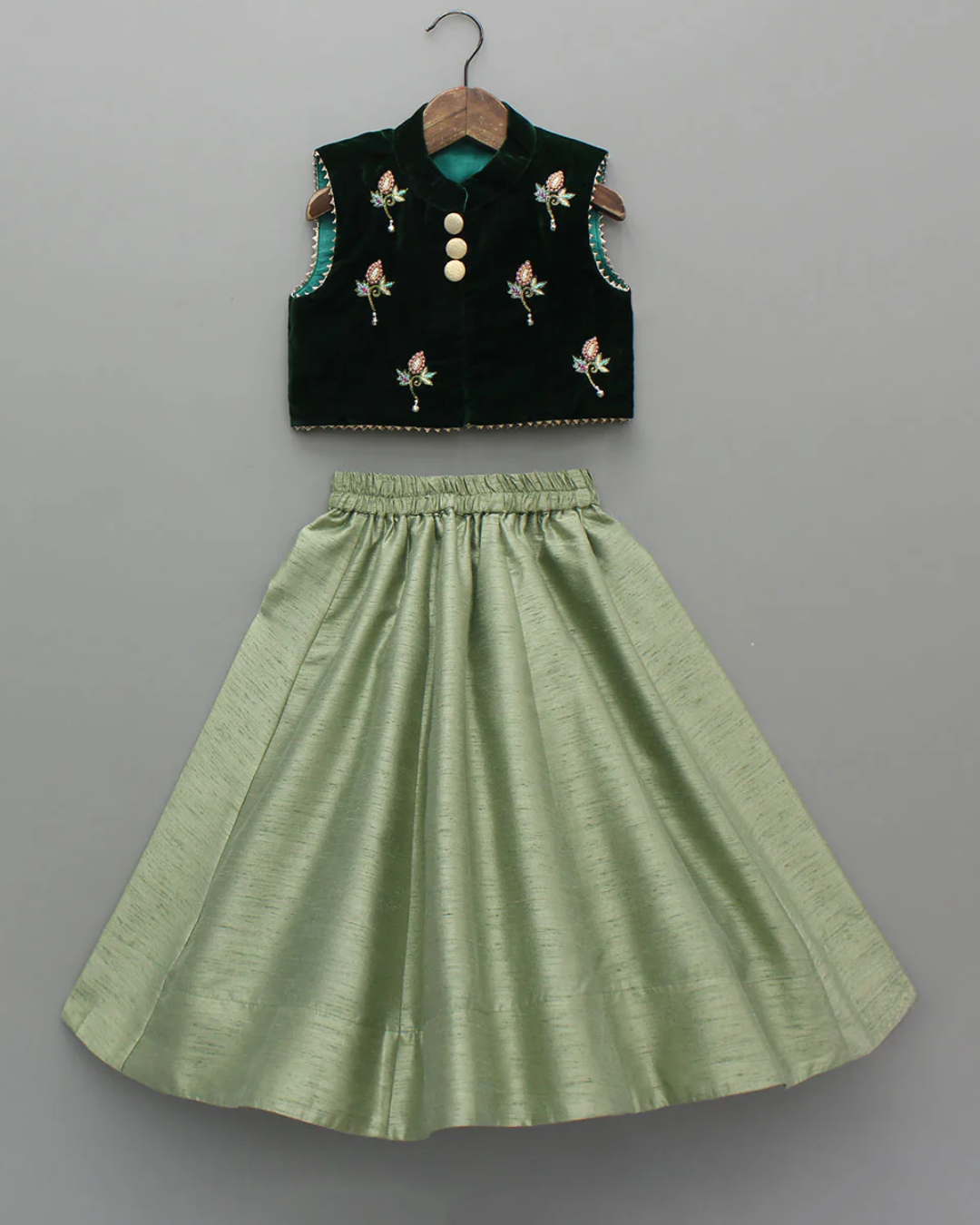 Hand embroidered green velvet top and lehenga