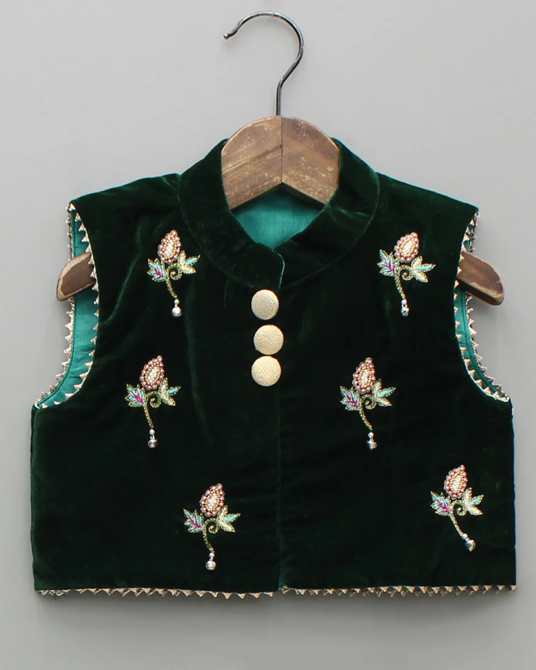 Hand embroidered green velvet top and lehenga