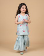 Load image into Gallery viewer, Girl wearing a sky blue Chanderi embroidered sleeveless kurta with matching flared sharara pants
