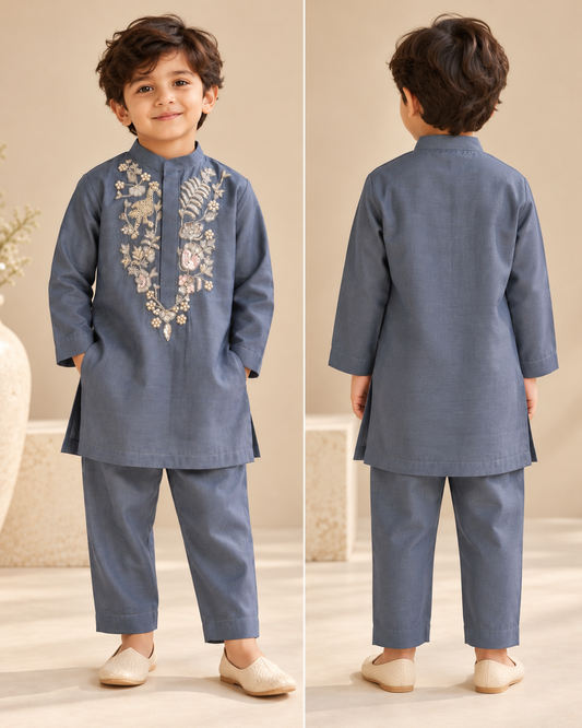 Boys slate blue Chanderi kurta and trouser set with intricate pearl and zardozi floral embroidery on the front.