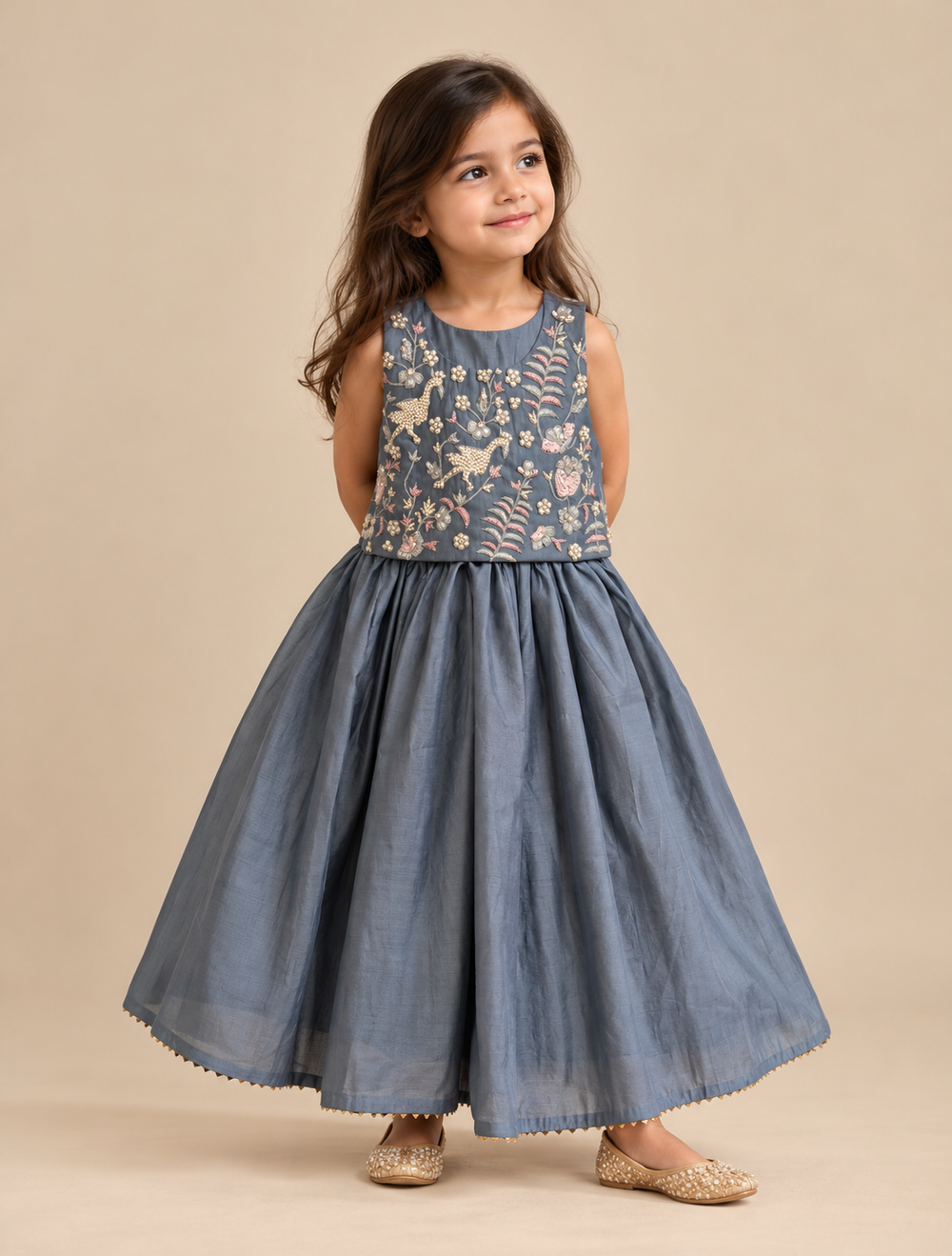 Girls' blue-grey Viscose Chanderi lehenga set with pearl-embellished floral and bird embroidery on the sleeveless top and a flared skirt.