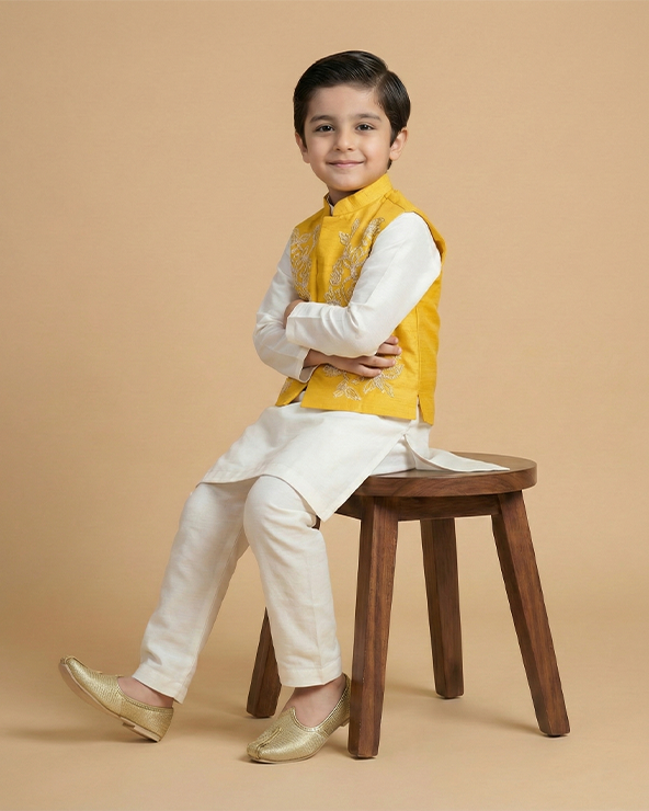 White kurta pyjama set with yellow raw silk embroidered jacket for boys