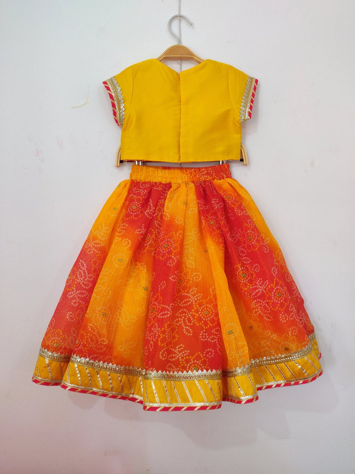 Girls yellow silk top & bandhani lehenga set   byb premium