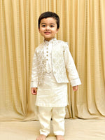 Load image into Gallery viewer, Off-White Chanderi Silk Kurta with Brocade Bandi and Pyjama Set for Boys. - BYB PREMIUM
