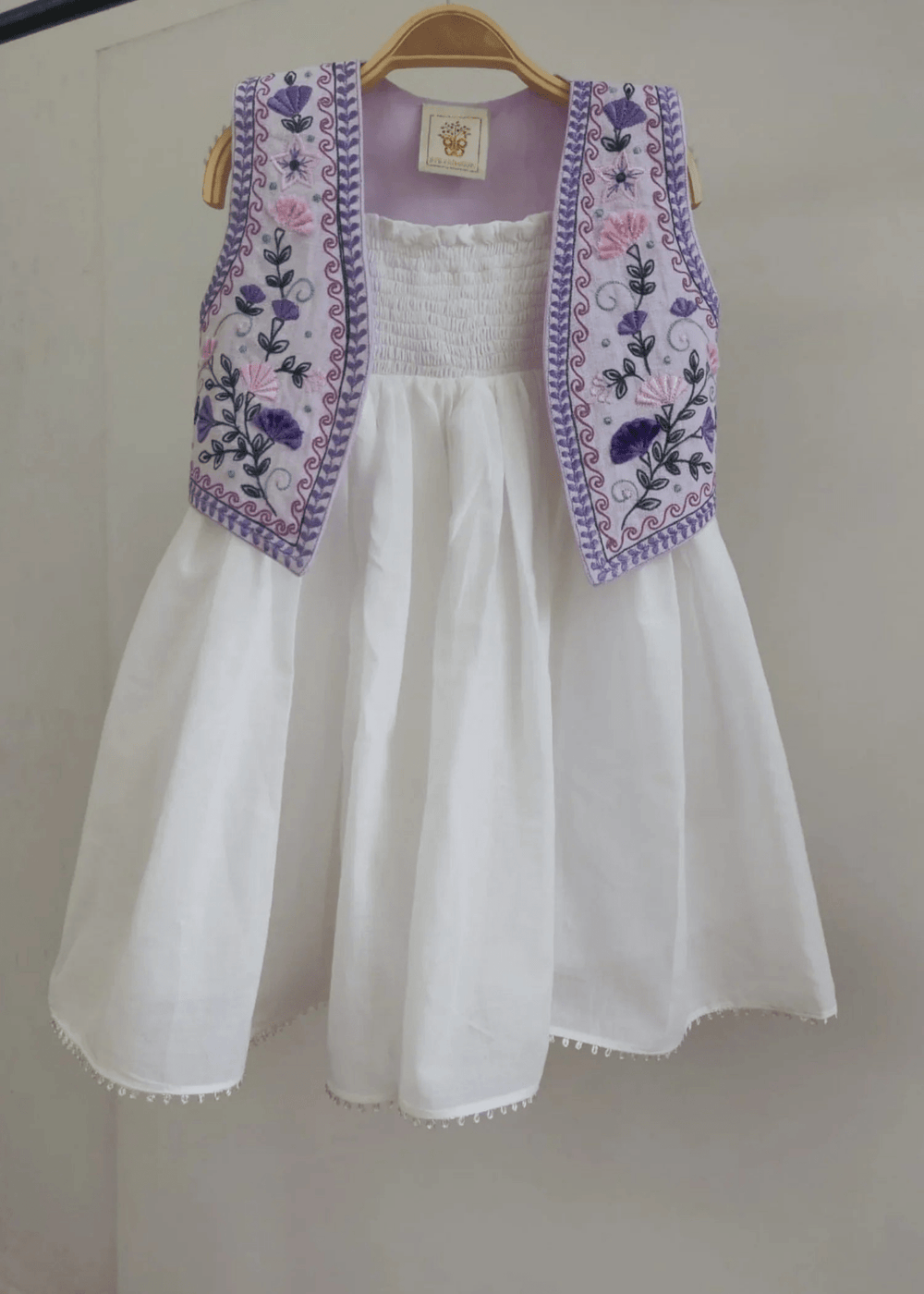 Off-White Mul Mul Cotton Dress with Lavender Linen Embroidered Shrug for Baby Girls - BYB PREMIUM