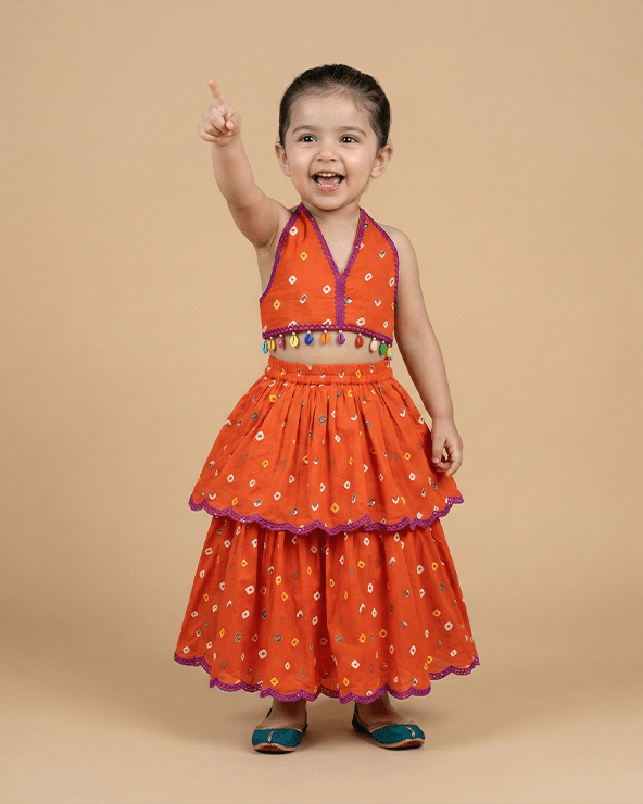 Orange Bandhani Embroidered V-Neck Top with Layered Lehenga Skirt for Girls - BYB PREMIUM