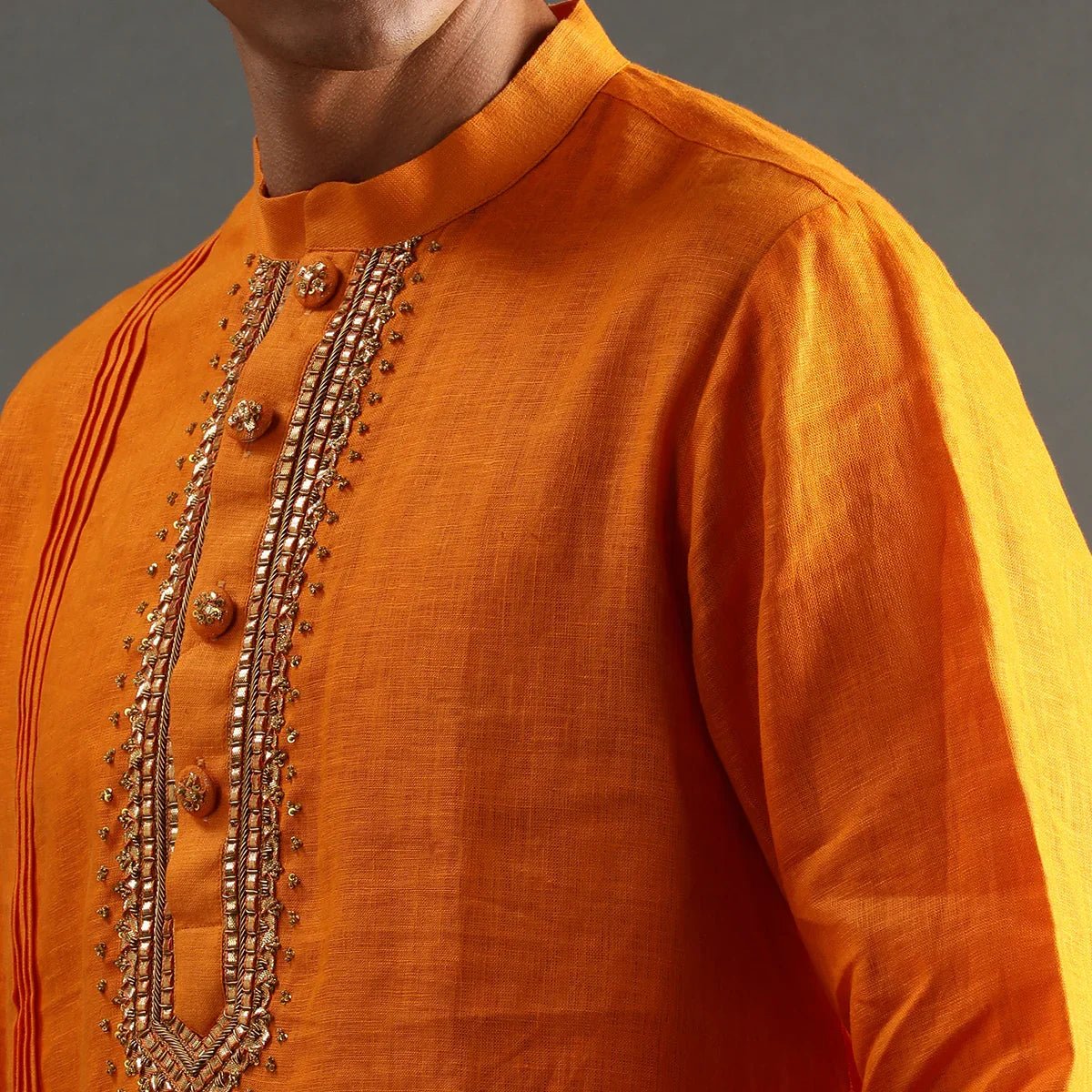 Orange linen kurta set with hand embroidery   byb premium
