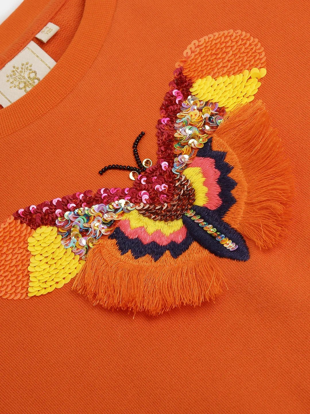 Orange sweatshirt with sequin butterfly embroidery   byb premium