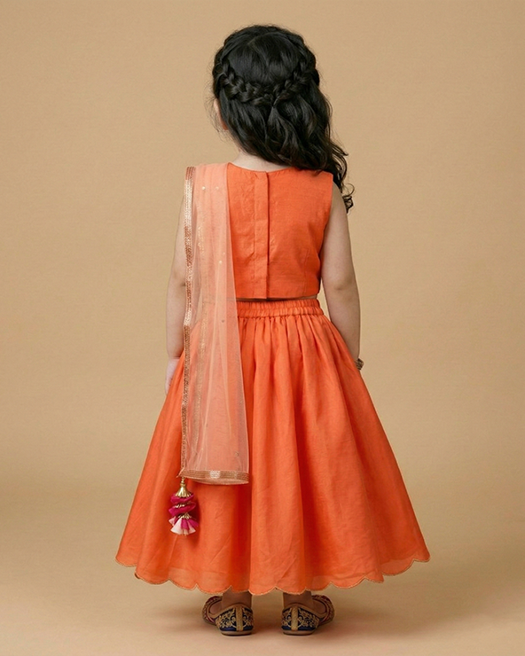Orange girls lehenga choli set in tussar silk with embroidery & net dupatta