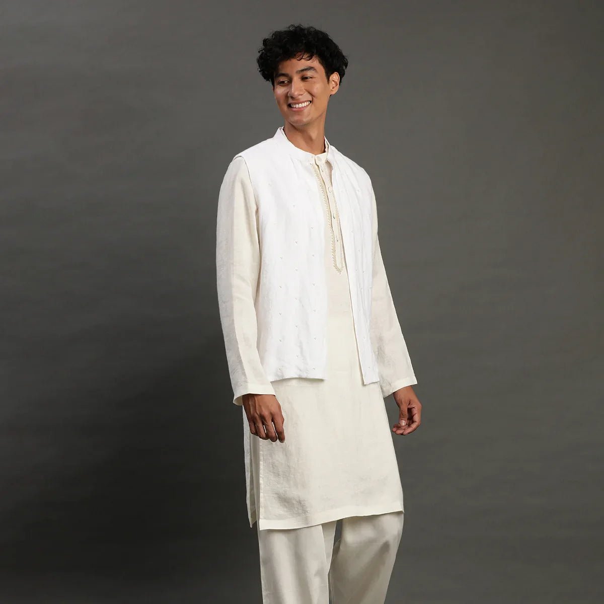 White linen kurta set with embroidered jacket   byb premium