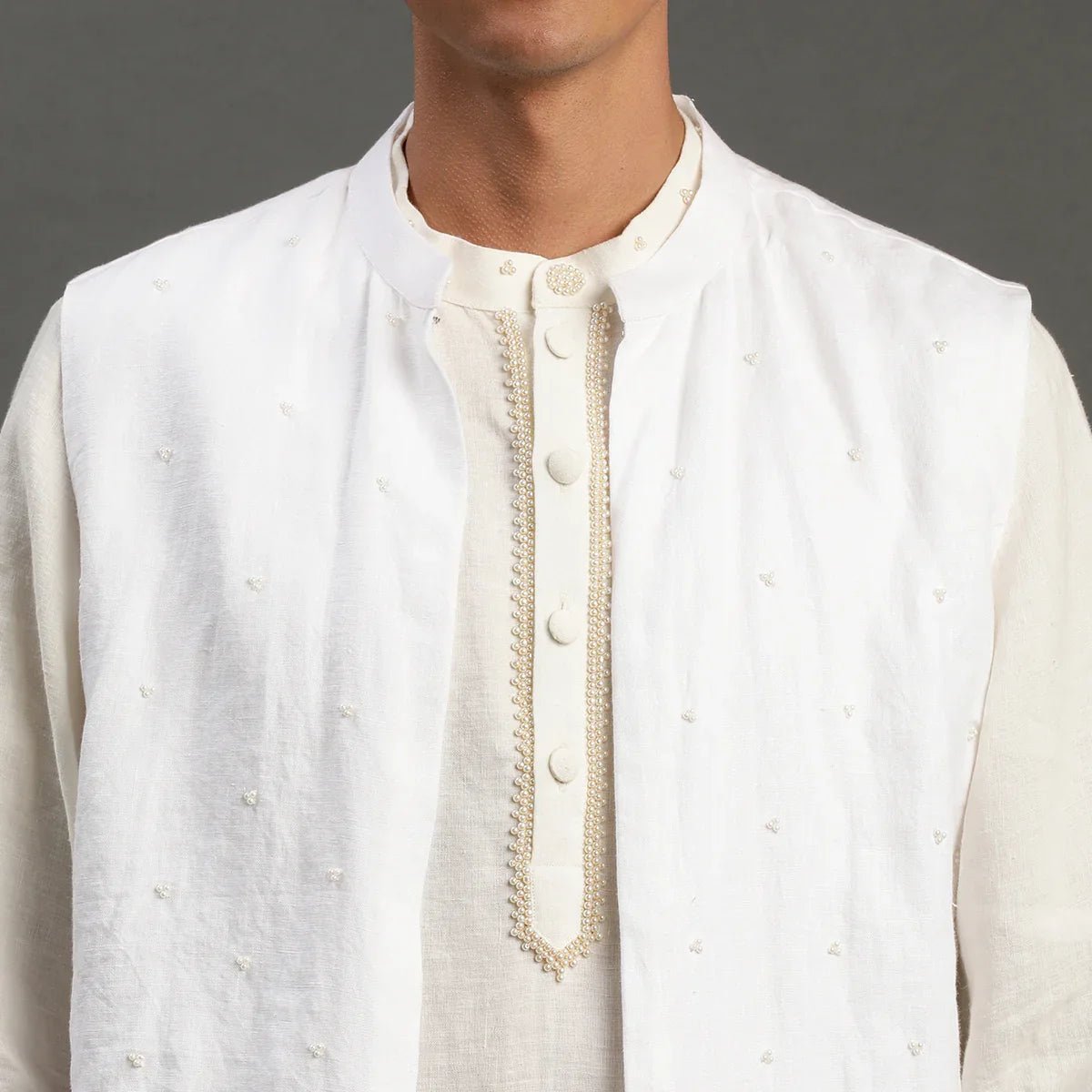 White linen kurta set with embroidered jacket   byb premium